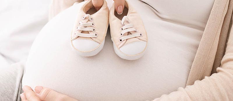 pregnant woman with booties