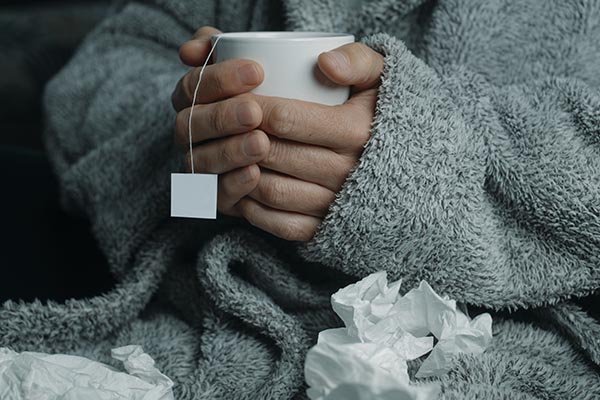 flu patient with tea