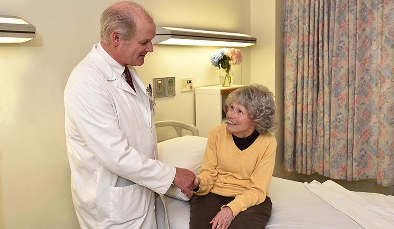 A doctor speaking with a female patient